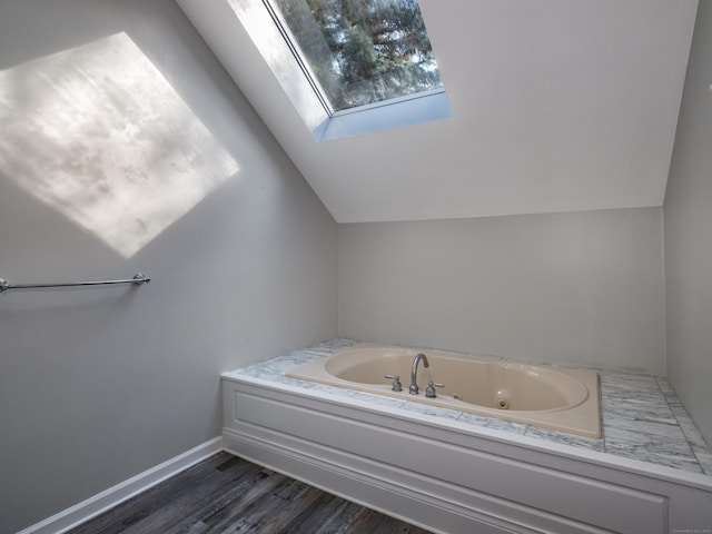 13 Longview Ter Unit 13, Madison, CT 06443 - bathroom with a skylight, a whirlpool tub, vaulted ceiling, and wood finished floors