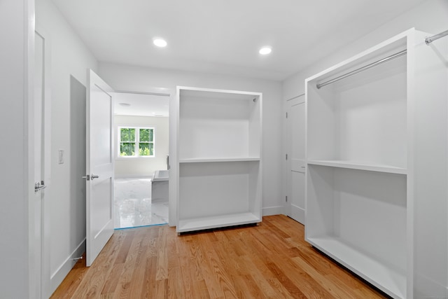 walk in closet featuring light wood-type flooring