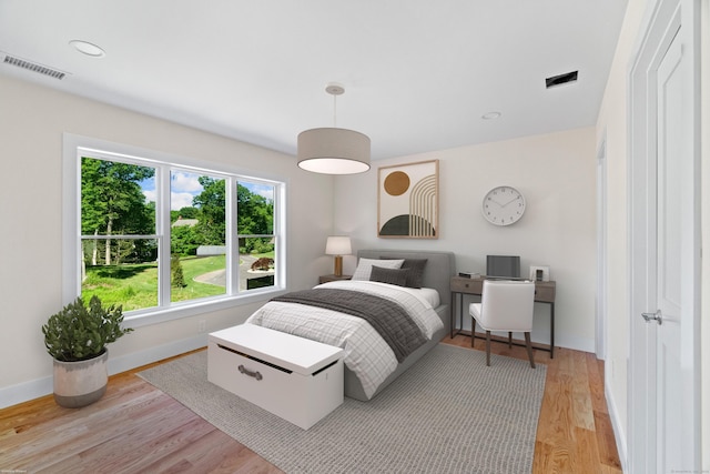 bedroom with light wood-type flooring