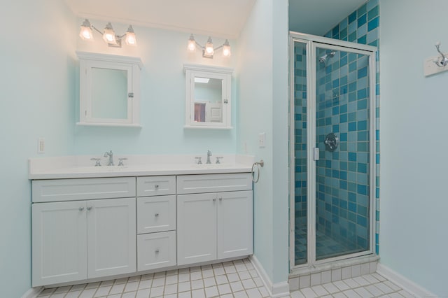 bathroom featuring tile patterned floors, vanity, and an enclosed shower