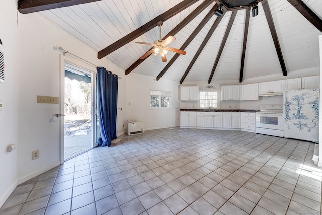 unfurnished living room with light tile patterned floors, ceiling fan, high vaulted ceiling, beamed ceiling, and baseboards