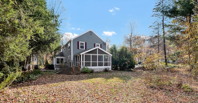 back of house with a sunroom