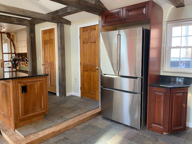 kitchen featuring stainless steel fridge and beam ceiling