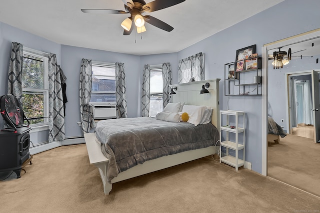 carpeted bedroom featuring cooling unit and ceiling fan