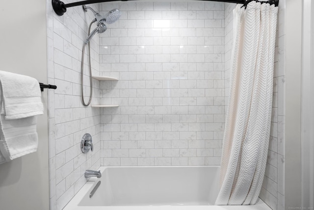 bathroom with shower / bath combo with shower curtain