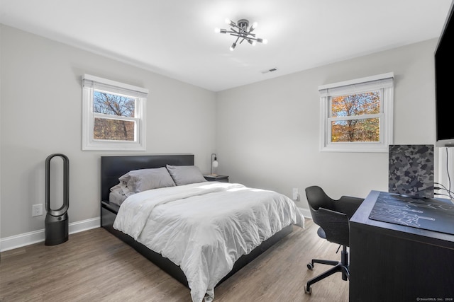 bedroom featuring dark hardwood / wood-style floors