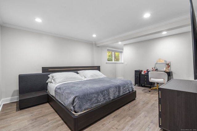 bedroom featuring light hardwood / wood-style flooring and crown molding