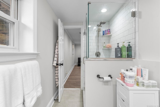 bathroom featuring walk in shower and hardwood / wood-style flooring