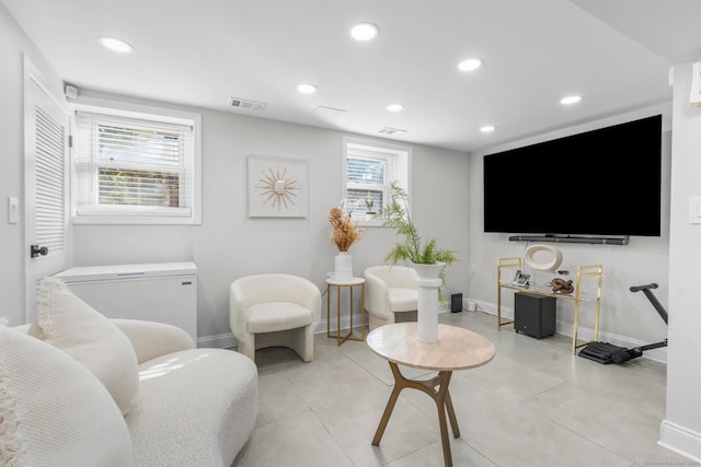 tiled living room featuring plenty of natural light