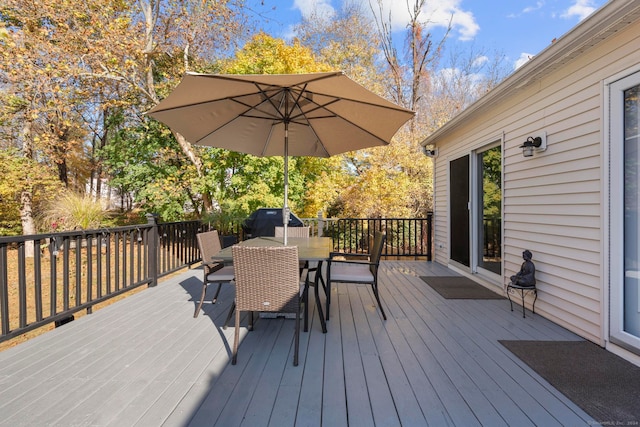 wooden deck featuring area for grilling