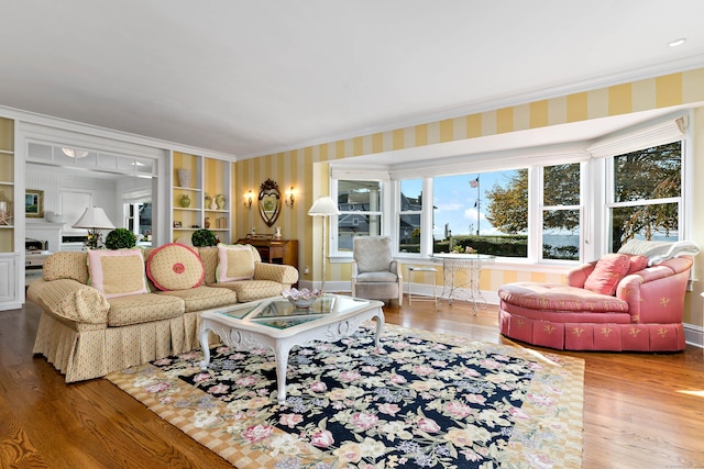 10 Island View Ave, Branford, CT 06405 - living area featuring wallpapered walls, crown molding, wood finished floors, and baseboards