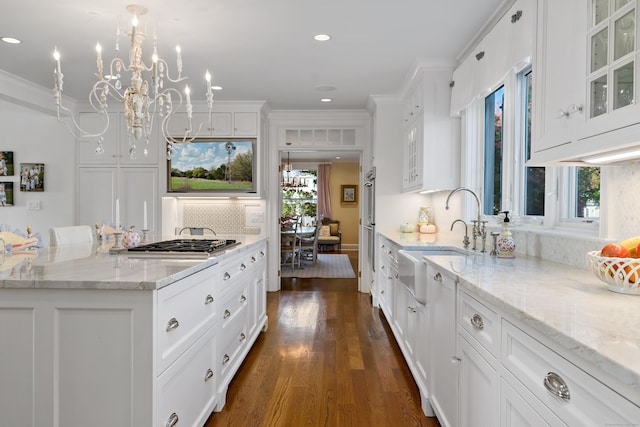10 Island View Ave, Branford, CT 06405 - kitchen featuring a sink, glass insert cabinets, white cabinetry, crown molding, and a notable chandelier