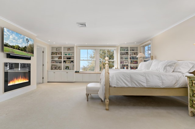 bedroom with crown molding and light colored carpet