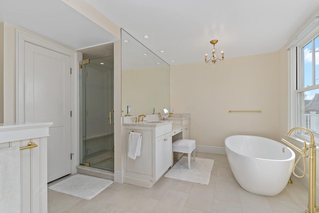 bathroom with vanity, tile patterned floors, shower with separate bathtub, and a chandelier