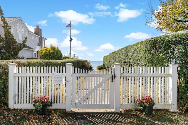 view of gate with a water view