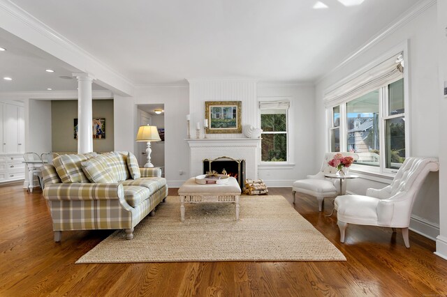 10 Island View Ave, Branford, CT 06405 - living area with decorative columns, wood finished floors, baseboards, and ornamental molding