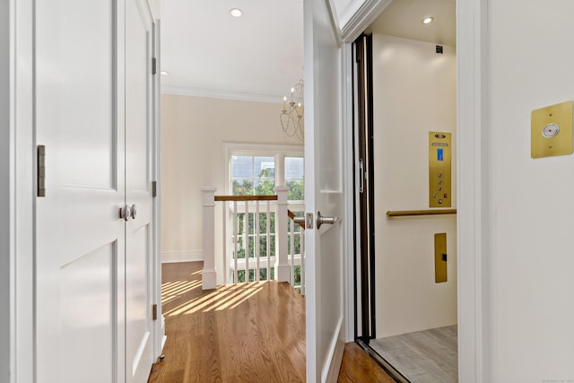 10 Island View Ave, Branford, CT 06405 - hall featuring an upstairs landing, wood finished floors, recessed lighting, crown molding, and baseboards