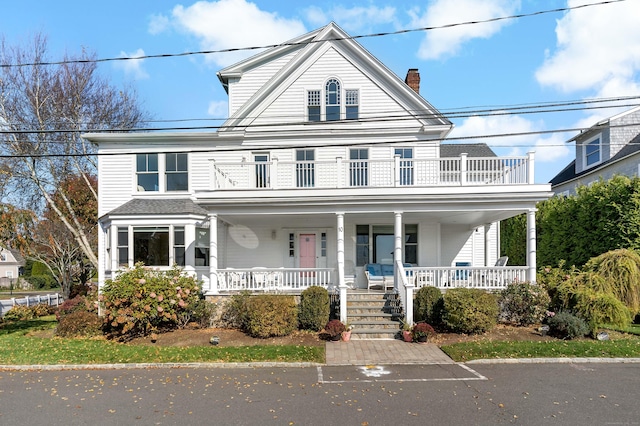 10 Island View Ave, Branford, CT 06405 - view of front of property featuring a balcony, covered porch, a chimney, and roof with shingles