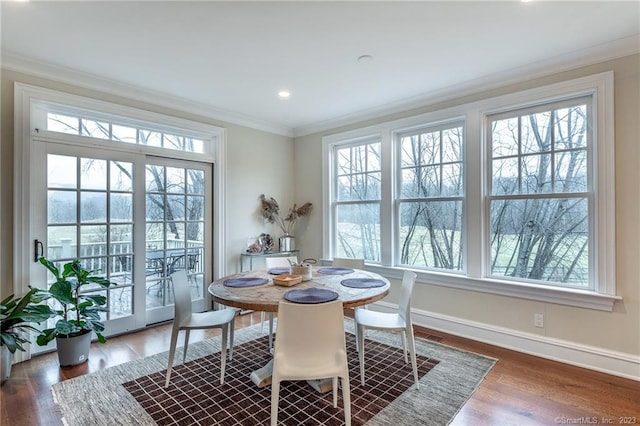 dining space featuring dark hardwood / wood-style floors and a healthy amount of sunlight