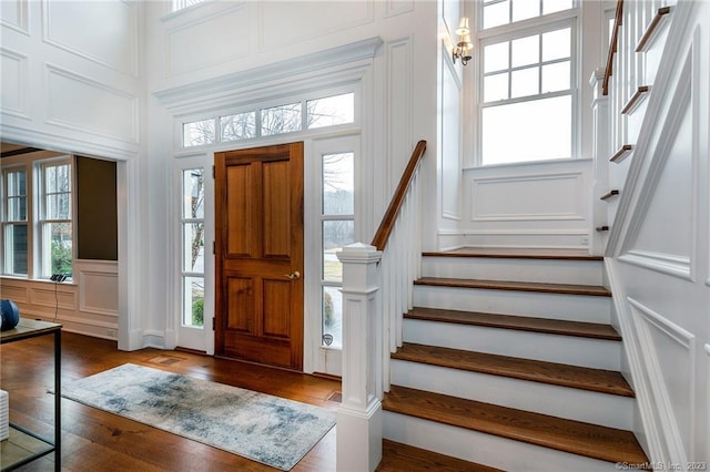 foyer with dark hardwood / wood-style floors