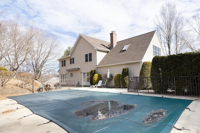 view of swimming pool with a patio, fence, and a fenced in pool