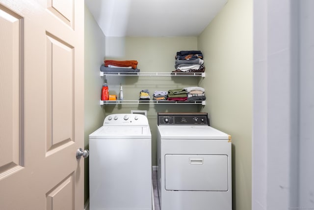 laundry room with independent washer and dryer and laundry area