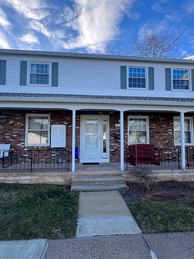 view of property with covered porch