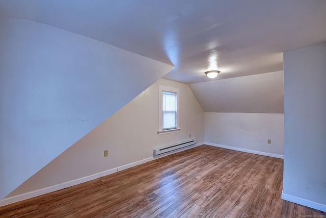 bonus room with lofted ceiling, hardwood / wood-style floors, and baseboard heating