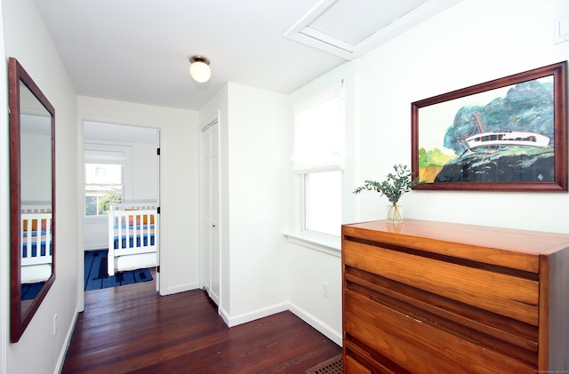 hall with dark hardwood / wood-style flooring