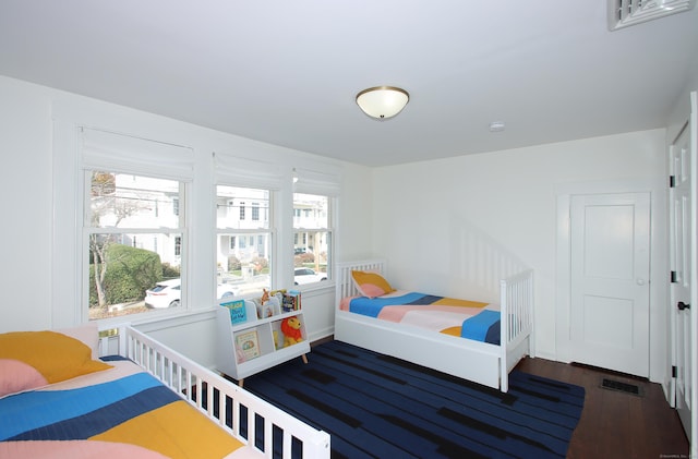 bedroom featuring dark wood-type flooring