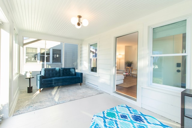 sunroom with a chandelier