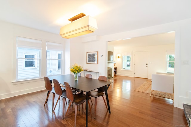 dining area featuring hardwood / wood-style flooring and plenty of natural light