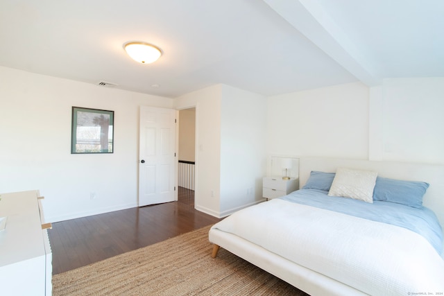 bedroom featuring dark hardwood / wood-style flooring