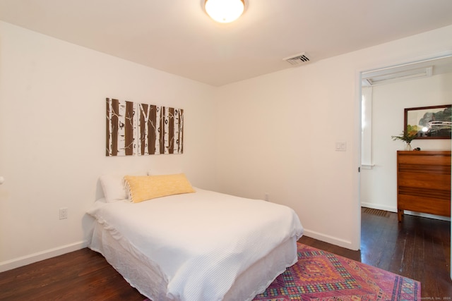 bedroom featuring dark hardwood / wood-style floors