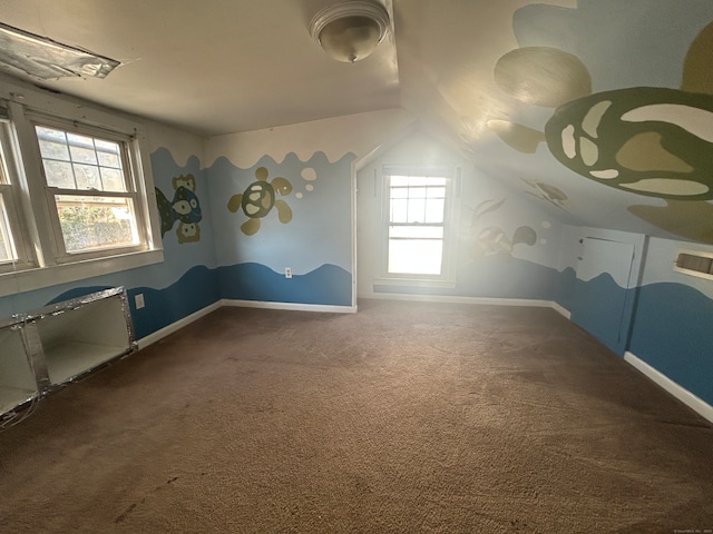 additional living space with lofted ceiling and carpet floors