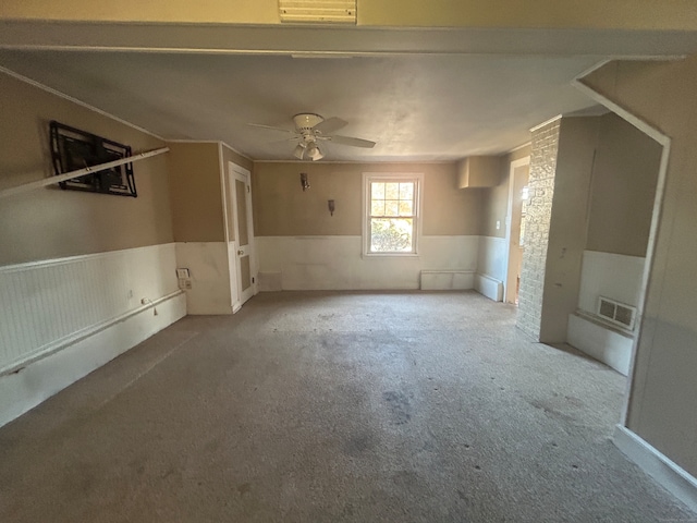 carpeted empty room with ceiling fan