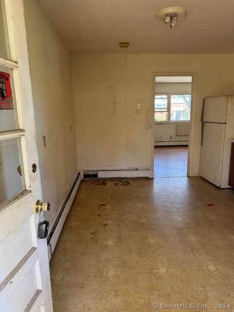 interior space featuring a baseboard heating unit