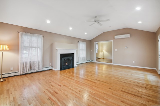 unfurnished living room with vaulted ceiling, ceiling fan, light hardwood / wood-style floors, and a wall unit AC