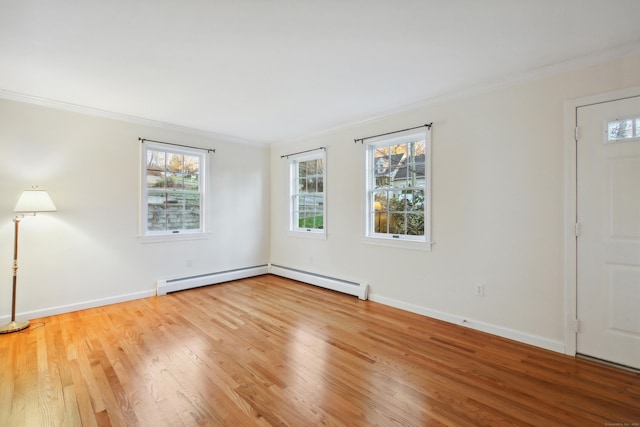 unfurnished room featuring crown molding, wood-type flooring, and baseboard heating