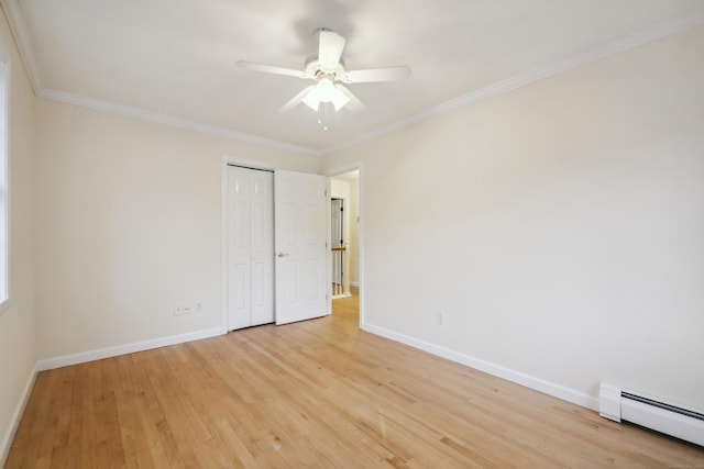 unfurnished bedroom featuring crown molding, a baseboard heating unit, ceiling fan, and light hardwood / wood-style flooring