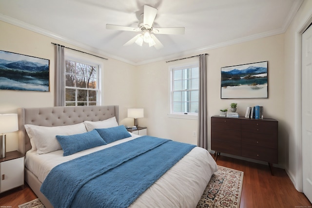 bedroom featuring ceiling fan, ornamental molding, and dark hardwood / wood-style flooring