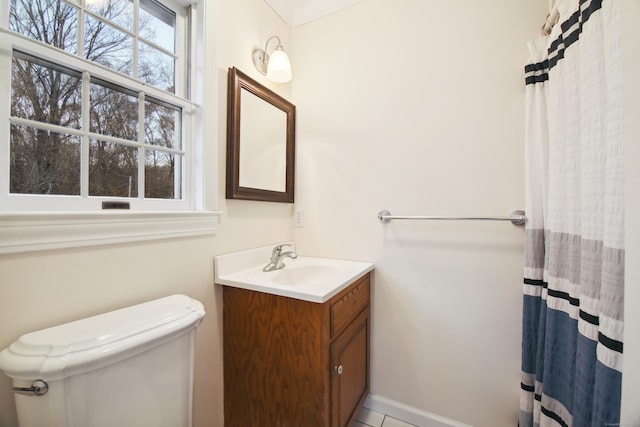 bathroom with vanity, tile patterned flooring, curtained shower, and toilet