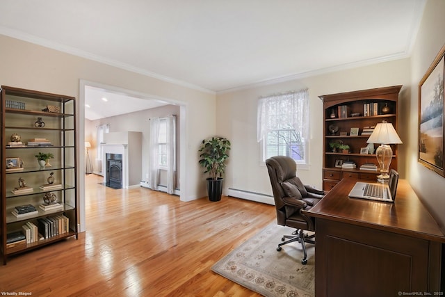 home office featuring a baseboard radiator, ornamental molding, and light hardwood / wood-style floors