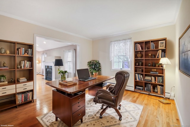 home office featuring a baseboard radiator, crown molding, and light hardwood / wood-style flooring