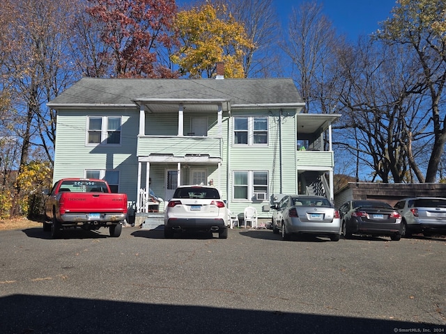 view of front of home with a balcony