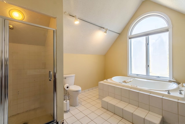 bathroom featuring tile patterned floors, independent shower and bath, vaulted ceiling, and toilet