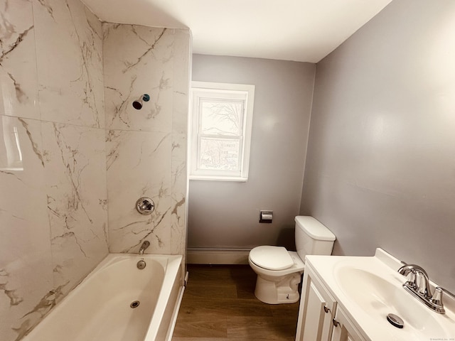 full bath with toilet, baseboards, wood finished floors, and vanity