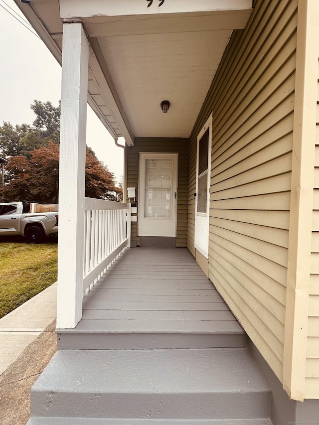 doorway to property with a porch