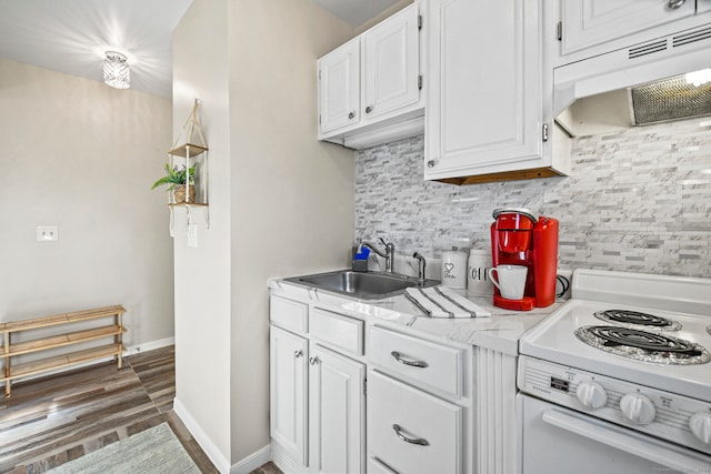 kitchen with dark hardwood / wood-style flooring, extractor fan, white cabinetry, white stove, and sink