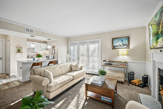 living room with crown molding and dark hardwood / wood-style flooring